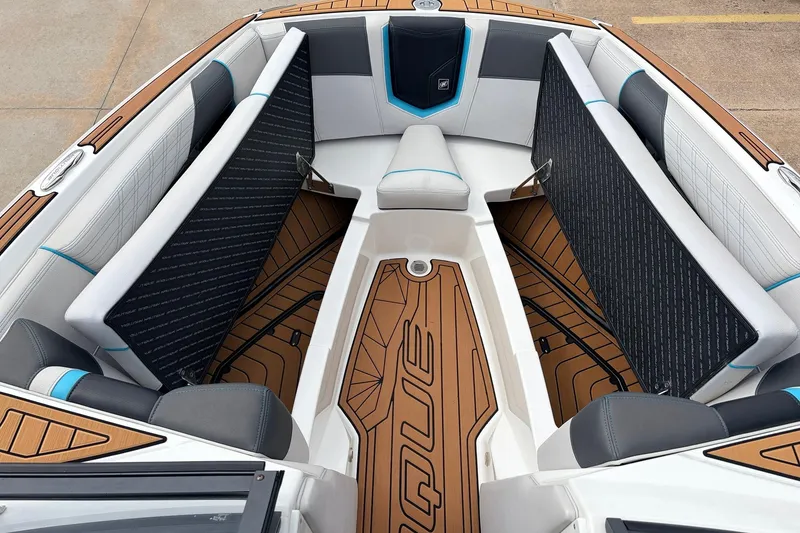 Slide: The Image of 2017 Nautique Super Air Nautique G23 boat interior with stylish seating and teak flooring. - 14