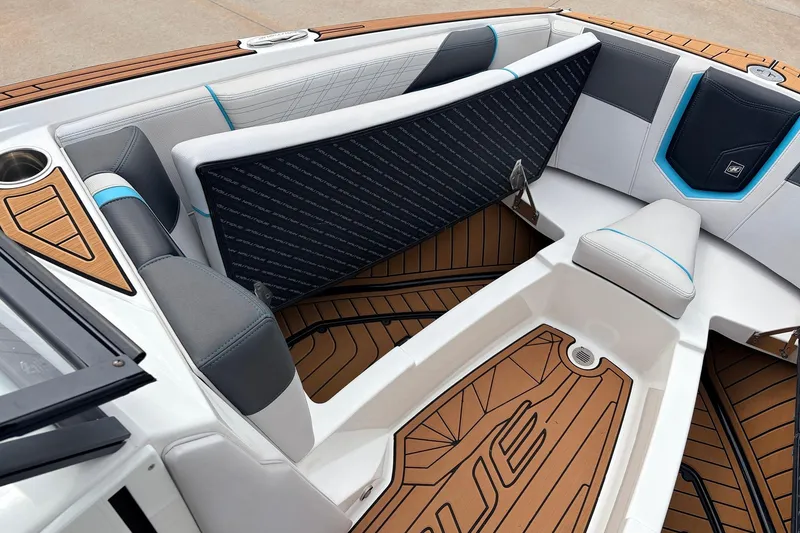 Slide: The Image of 2017 Nautique Super Air Nautique G23 interior with stylish seating and teak flooring. - 15
