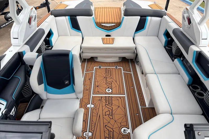 Slide: The Image of 2017 Nautique Super Air Nautique G23 interior with stylish seating and teak flooring. - 17
