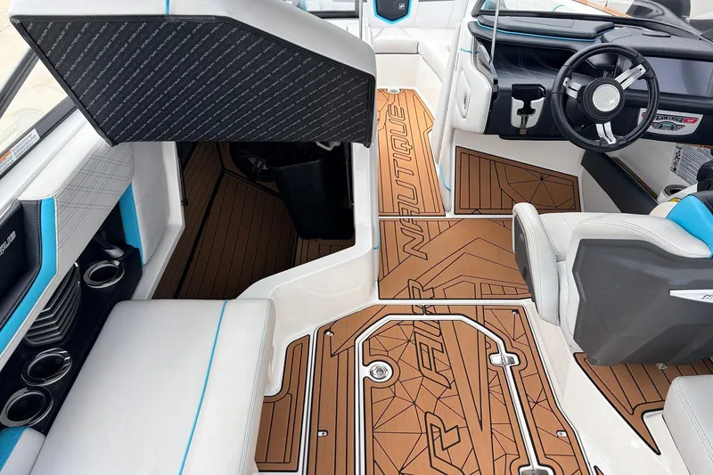 Slide: The Image of 2017 Nautique Super Air Nautique G23 interior with stylish seating and detailed flooring. - 19
