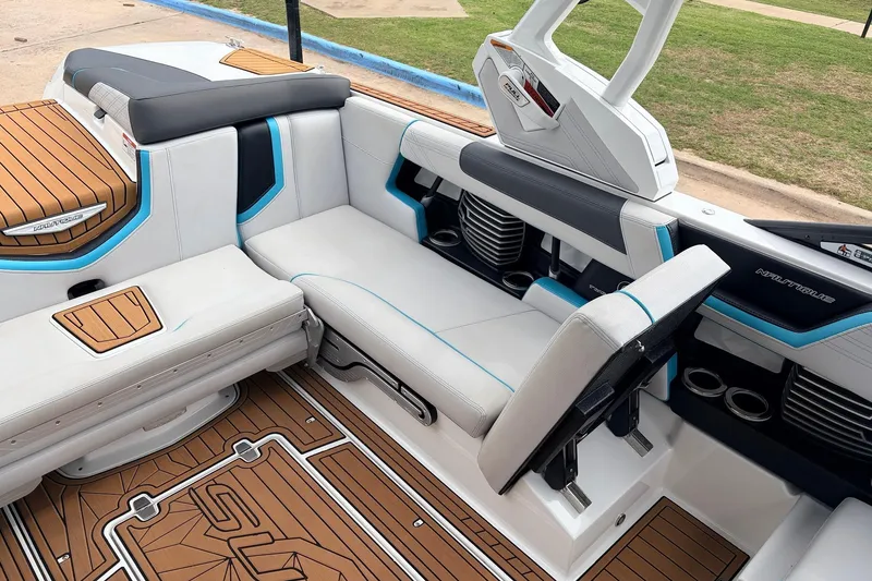 Slide: The Image of 2017 Nautique Super Air Nautique G23 interior with stylish seating and teak flooring. - 22