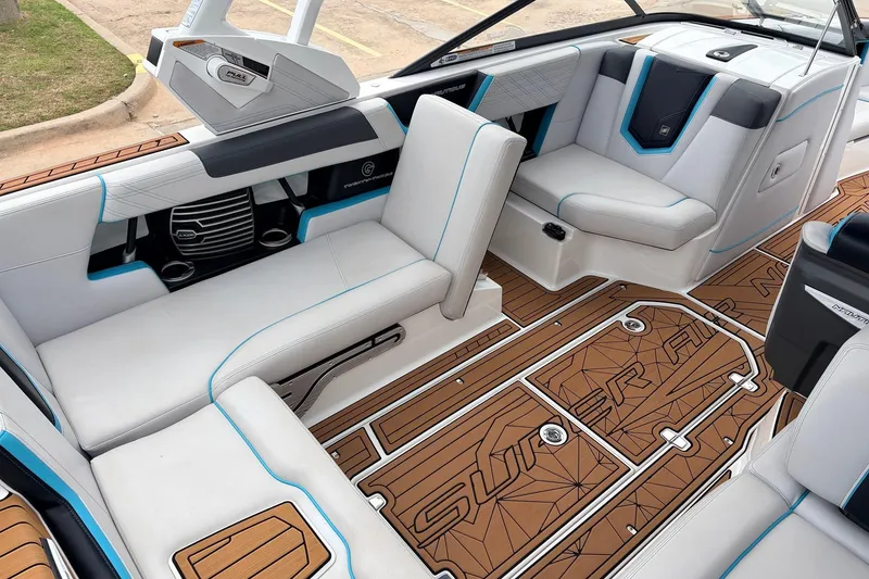 Slide: The Image of Interior of a 2017 Nautique Super Air Nautique G23 boat with stylish seating and teak flooring. - 23