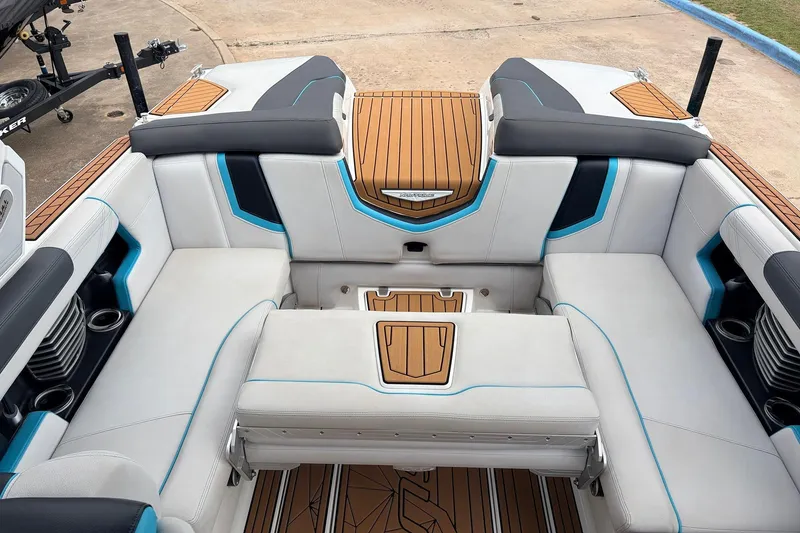 Slide: The Image of 2017 Nautique Super Air Nautique G23 boat interior with stylish seating and teak accents. - 26