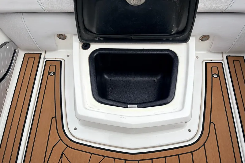 Slide: The Image of Open storage compartment on 2017 Nautique Super Air Nautique G23 boat deck. - 31