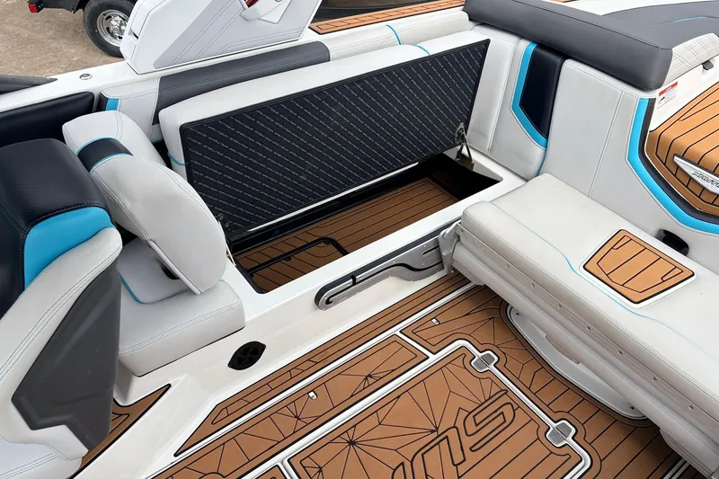 Slide: The Image of 2017 Nautique Super Air Nautique G23 interior with open storage compartment and stylish seating. - 33