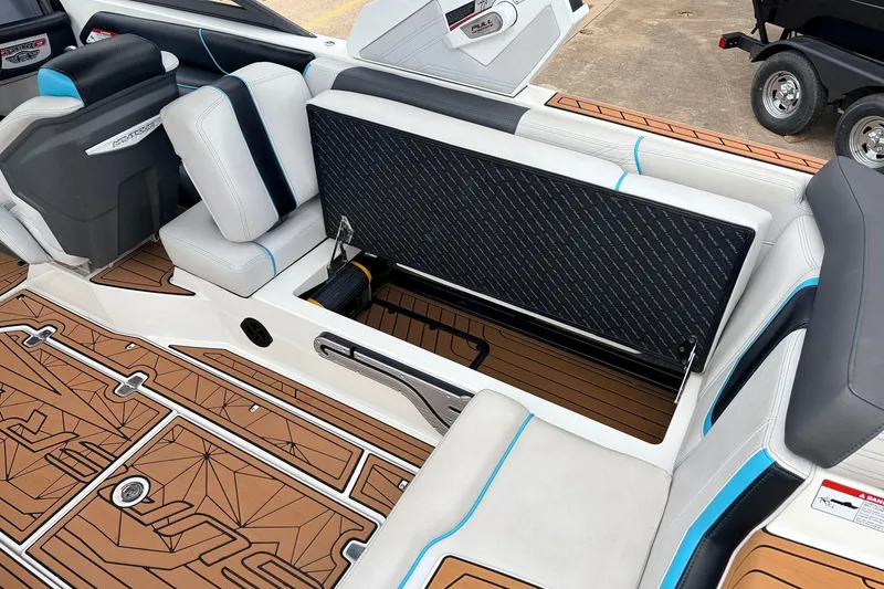 Slide: The Image of 2017 Nautique Super Air Nautique G23 interior with open storage compartment and stylish seating. - 34
