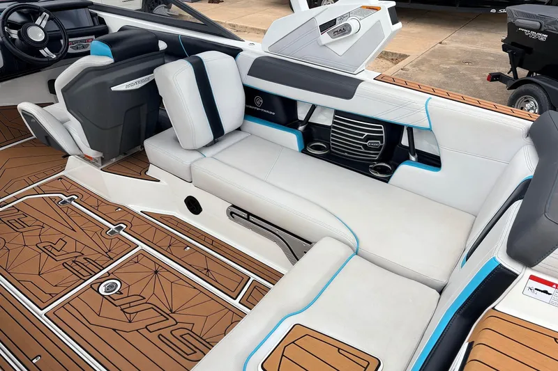 Slide: The Image of 2017 Nautique Super Air Nautique G23 interior with white seating and brown deck accents. - 35