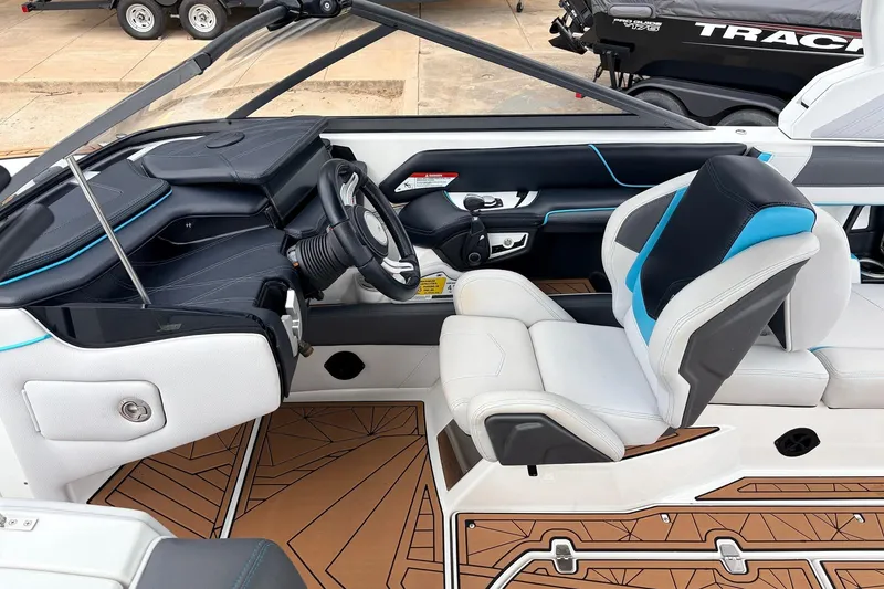 Slide: The Image of 2017 Nautique Super Air Nautique G23 boat interior with modern helm and seating. - 36