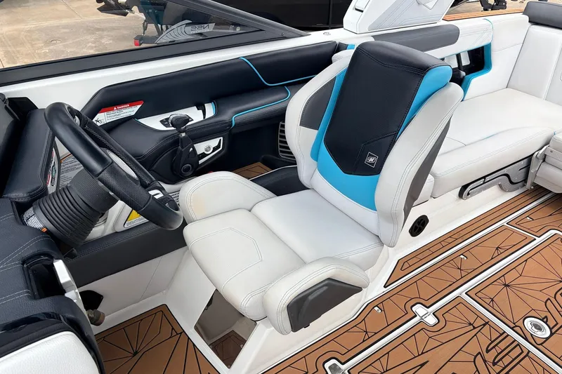 Slide: The Image of 2017 Nautique Super Air Nautique G23 interior with sleek steering and modern seating design. - 37