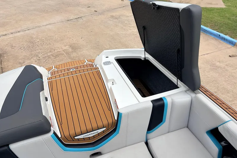 Slide: The Image of 2017 Nautique Super Air Nautique G23 boat with open storage compartment and stylish seating. - 40