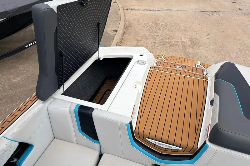 Slide: The Image of 2017 Nautique Super Air Nautique G23 boat interior with open storage compartment. - 41