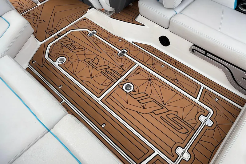 Slide: The Image of 2017 Nautique Super Air Nautique G23 interior with custom brown deck flooring. - 44