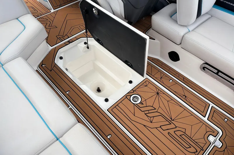 Slide: The Image of 2017 Nautique Super Air Nautique G23 interior with open storage compartment and stylish seating. - 45