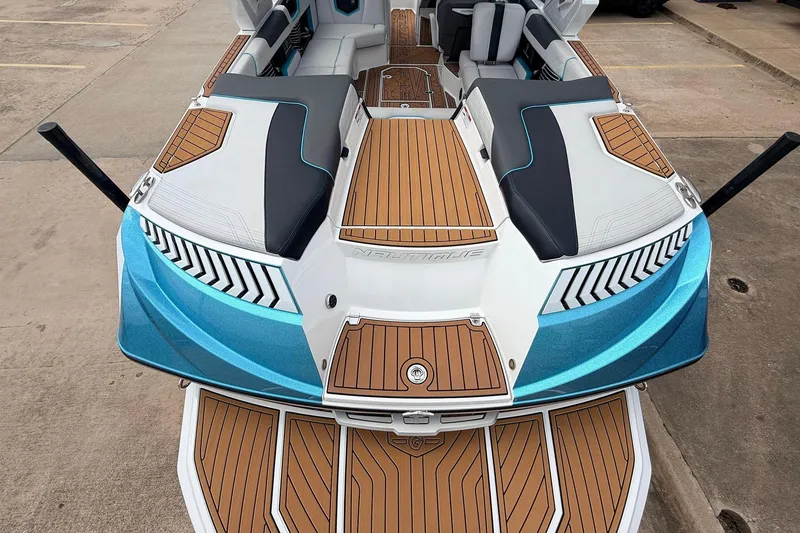 Slide: The Image of 2017 Nautique Super Air Nautique G23 boat with teak deck and blue accents. - 48