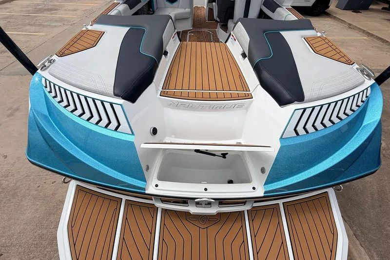 Slide: The Image of 2017 Nautique Super Air Nautique G23 boat with sleek design and teak flooring. - 49