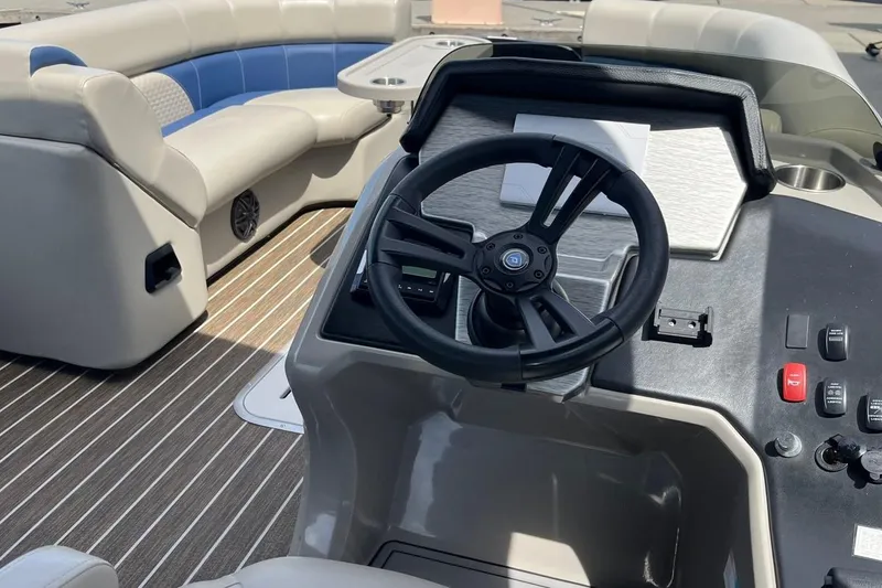 Slide: The Image of Interior of 2022 Premier 230 Sunsation RF - CL pontoon boat with steering wheel and seating. - 6