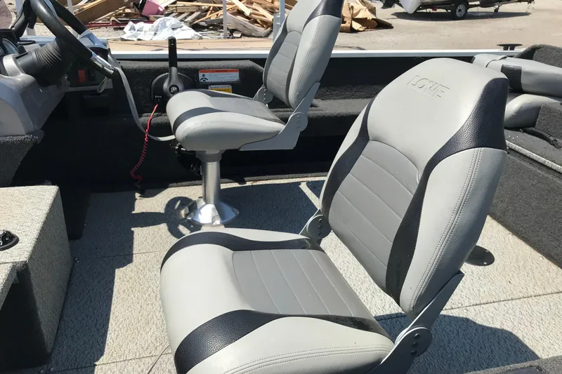 Slide: The Image of 2014 Lowe Fishing Machine 165SC Pro boat interior with two gray seats. - 21