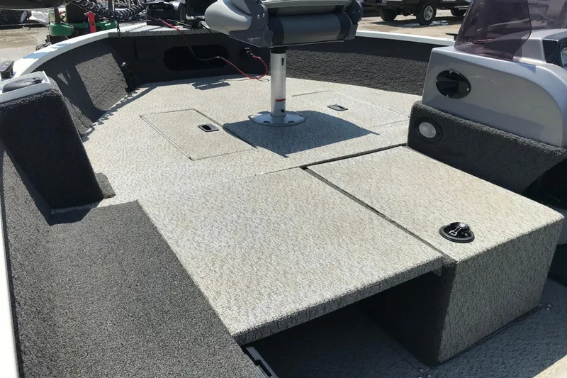 Slide: The Image of 2014 Lowe Fishing Machine 165SC Pro boat interior with seating and storage compartments. - 22