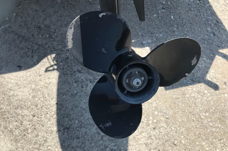 Slide: The Image of Propeller of 2014 Lowe Fishing Machine 165SC Pro on gravel surface. - 25