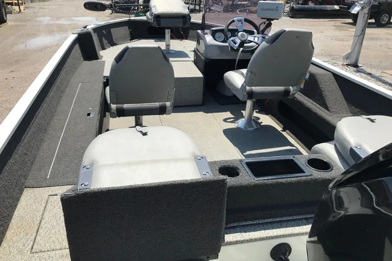 Slide: The Image of 2014 Lowe Fishing Machine 165SC Pro interior with seating and steering console. - 26