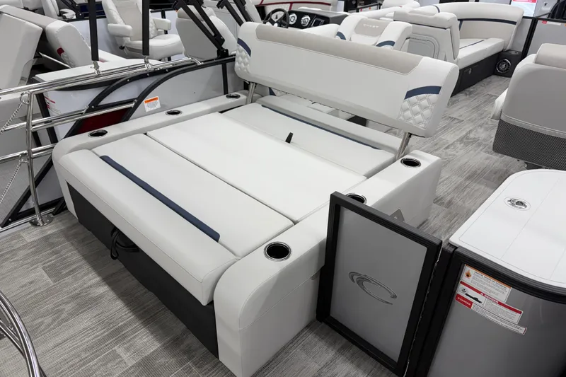 Slide: The Image of 2026 Crest Conquest 210 SLS boat interior with luxurious seating and modern design. - 10