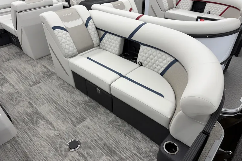 Slide: The Image of Luxurious seating on 2026 Crest Conquest 210 SLS boat, featuring elegant upholstery and modern design. - 2