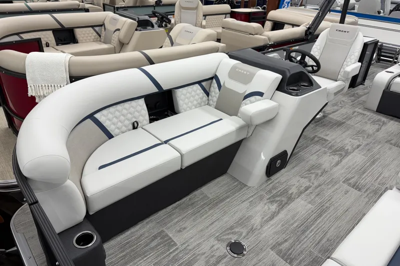 Slide: The Image of 2026 Crest Conquest 210 SLS boat interior with luxurious seating and modern design. - 3