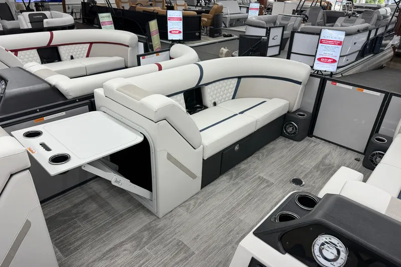 Slide: The Image of 2026 Crest Conquest 210 SLS pontoon boat interior with seating and table. - 7