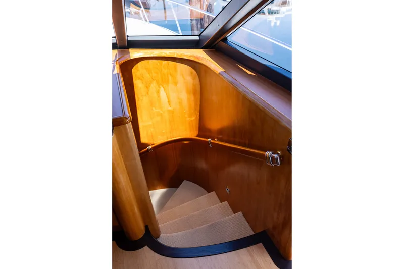 Slide: The Image of Elegant wooden staircase inside 2005 West Bay 86 Raised Pilothouse Motor Yacht. - 51