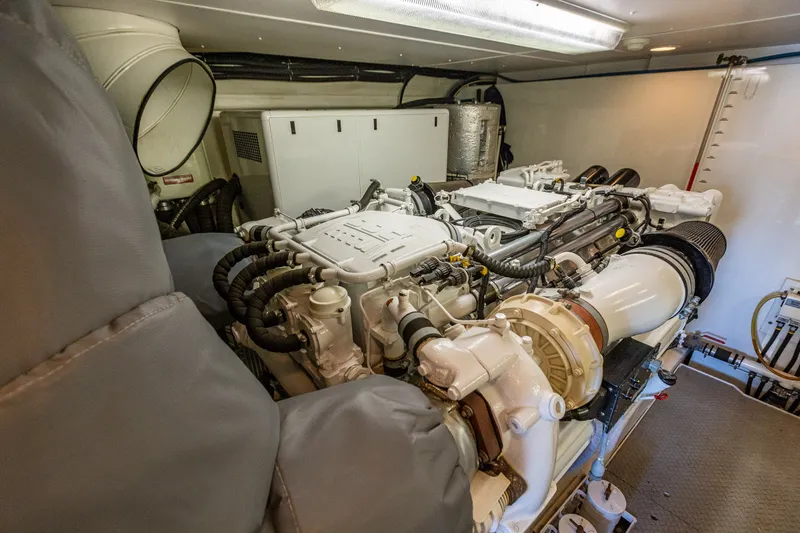 Slide: The Image of Engine room of 2005 West Bay 86 Raised Pilothouse Motor Yacht, showcasing powerful machinery. - 118