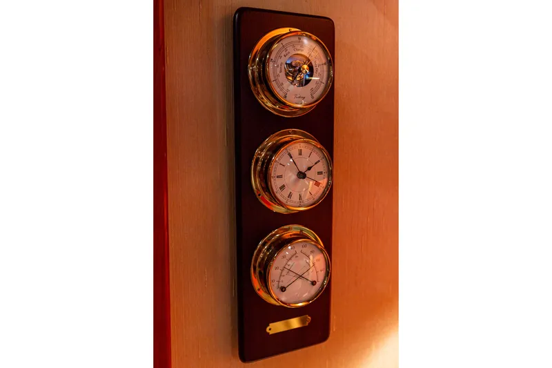 Slide: The Image of Wall-mounted nautical instruments on 2005 West Bay 86 Raised Pilothouse Motor Yacht. - 142