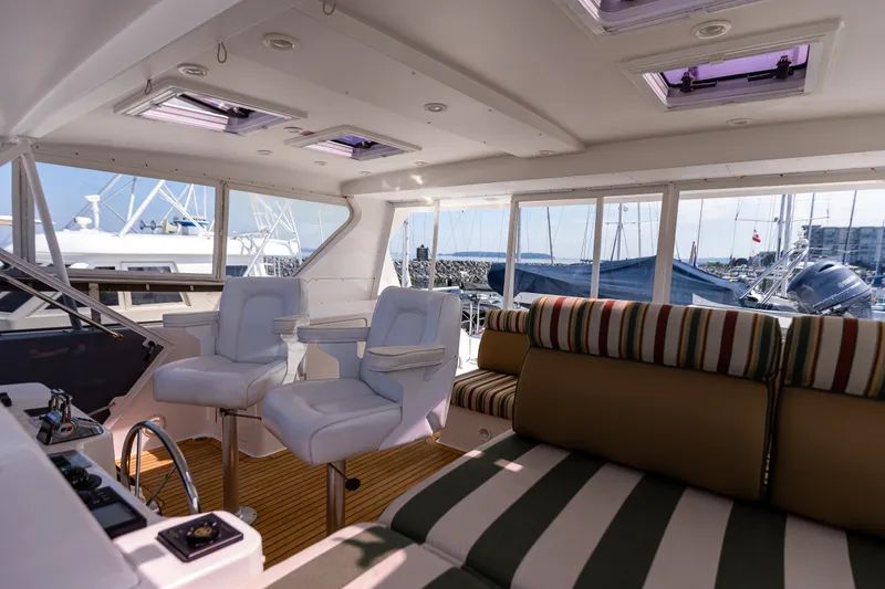 Slide: The Image of Luxurious interior of 2005 West Bay 86 Raised Pilothouse Motor Yacht with plush seating. - 96