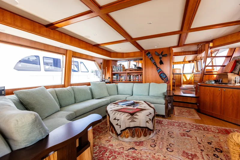 Slide: The Image of Luxurious interior of 2005 West Bay 86 Raised Pilothouse Motor Yacht with elegant wood finishes. - 14
