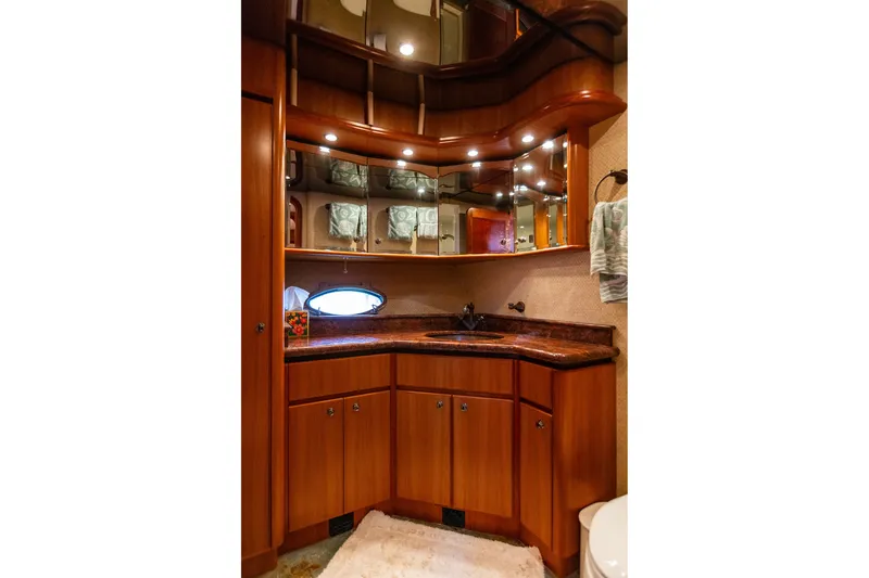 Slide: The Image of Luxurious bathroom in 2005 West Bay 86 Raised Pilothouse Motor Yacht with elegant wood cabinetry. - 71
