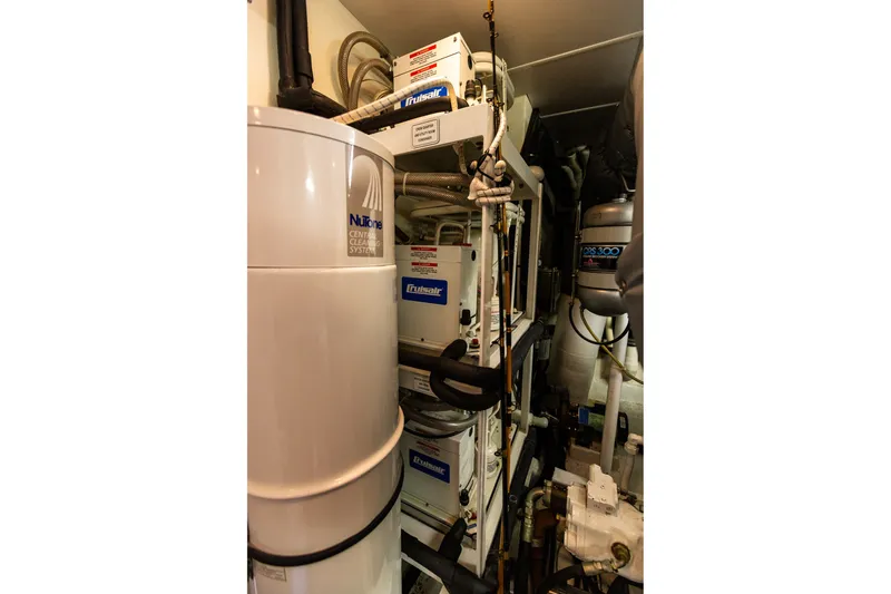 Slide: The Image of Engine room of 2005 West Bay 86 Raised Pilothouse Motor Yacht with equipment and systems. - 127