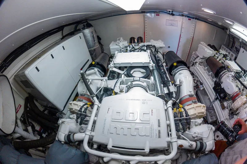 Slide: The Image of Engine room of 2005 West Bay 86 Raised Pilothouse Motor Yacht, showcasing powerful machinery. - 114