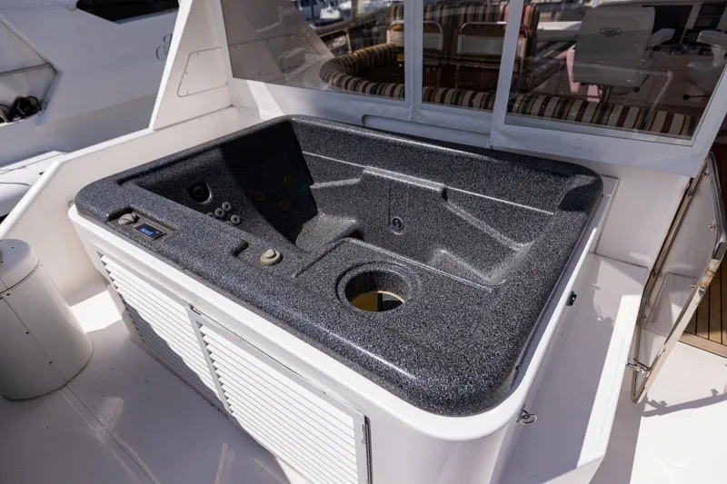 Slide: The Image of Luxurious hot tub on 2005 West Bay 86 Raised Pilothouse Motor Yacht deck. - 104