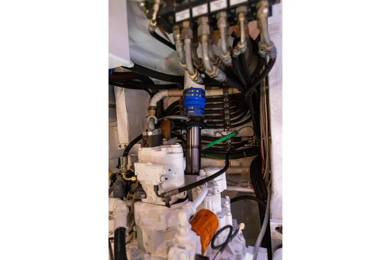Slide: The Image of Engine room of 2005 West Bay 86 Raised Pilothouse Motor Yacht, showcasing mechanical components. - 125