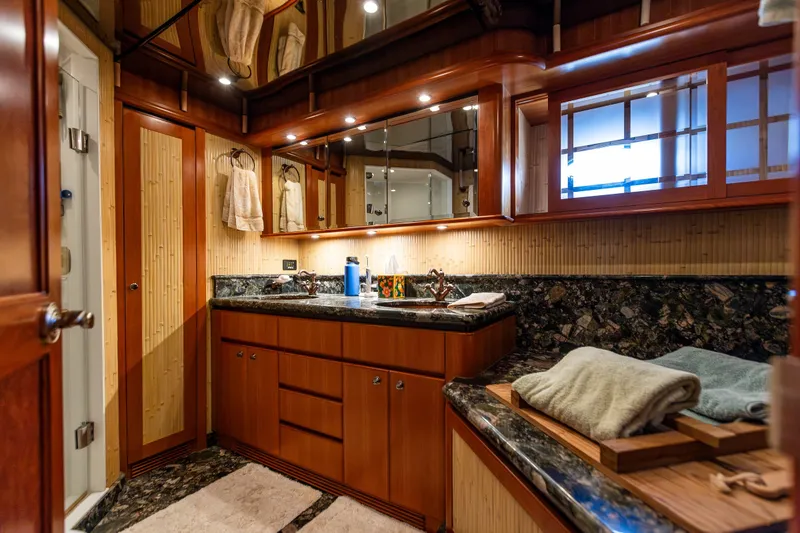 Slide: The Image of Luxurious bathroom in 2005 West Bay 86 Raised Pilothouse Motor Yacht with elegant wood and marble finishes. - 70