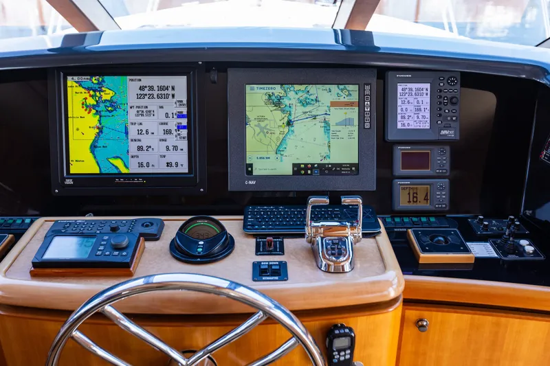 Slide: The Image of Pilothouse of 2005 West Bay 86 Yacht with navigation screens and controls. - 39