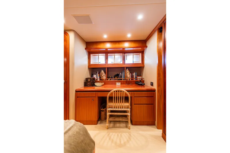 Slide: The Image of Luxurious wooden desk area in 2005 West Bay 86 Raised Pilothouse Motor Yacht. - 63