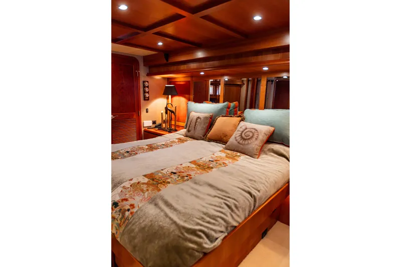 Slide: The Image of Luxurious bedroom interior of 2005 West Bay 86 Raised Pilothouse Motor Yacht, featuring elegant bedding. - 62