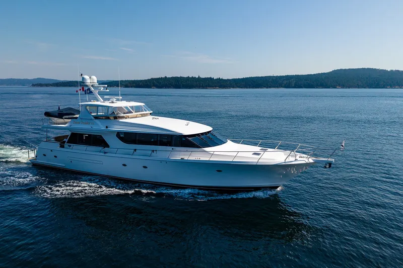 Slide: The Image of 2005 West Bay 86 Raised Pilothouse Motor Yacht cruising on open water. - 156