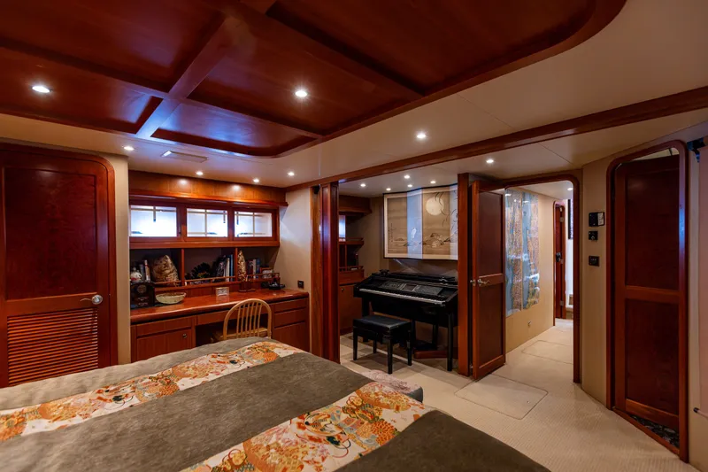 Slide: The Image of Luxurious interior of 2005 West Bay 86 Raised Pilothouse Motor Yacht with elegant wood finishes. - 57