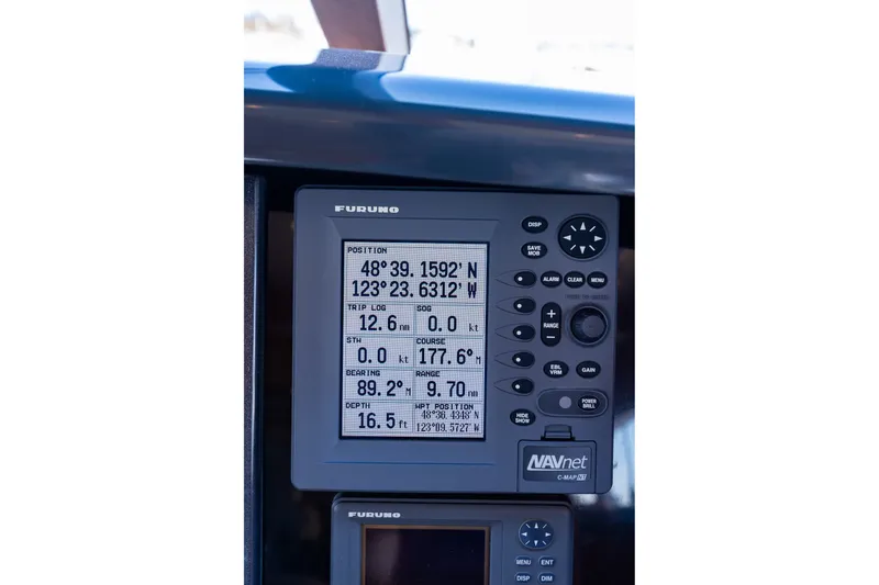 Slide: The Image of Furuno navigation display on 2005 West Bay 86 Raised Pilothouse Motor Yacht, showing coordinates and trip data. - 49