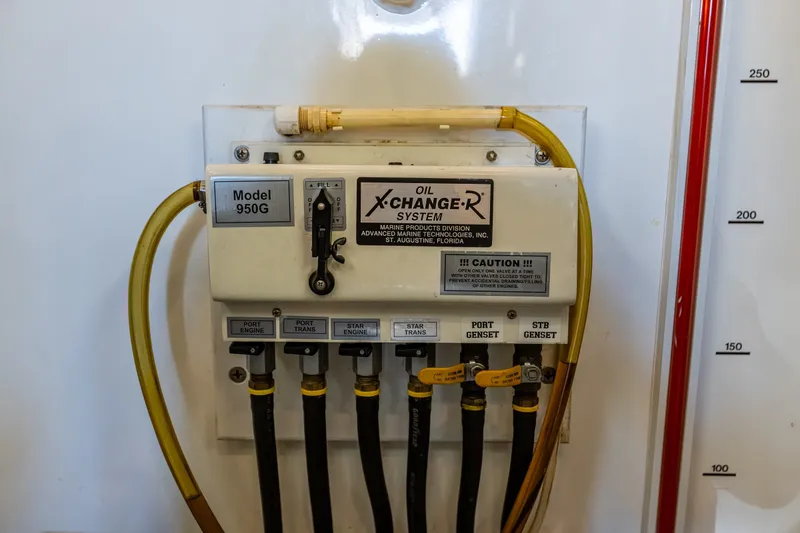 Slide: The Image of Oil change system panel on 2005 West Bay 86 Raised Pilothouse Motor Yacht. - 122