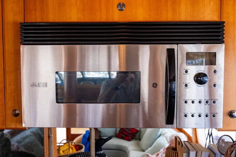 Slide: The Image of Stainless steel microwave in 2005 West Bay 86 Raised Pilothouse Motor Yacht kitchen. - 25