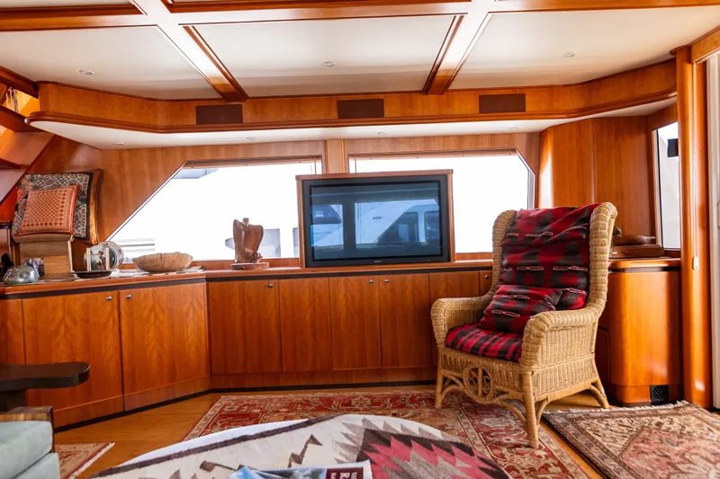 Slide: The Image of Luxurious interior of 2005 West Bay 86 Raised Pilothouse Motor Yacht with elegant wood paneling. - 18