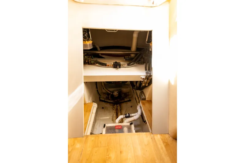 Slide: The Image of Engine room of 2005 West Bay 86 Raised Pilothouse Motor Yacht, showcasing mechanical components. - 143