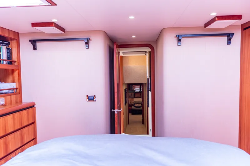 Slide: The Image of Interior of 2005 West Bay 86 Raised Pilothouse Motor Yacht, featuring cozy cabin and hallway view. - 81
